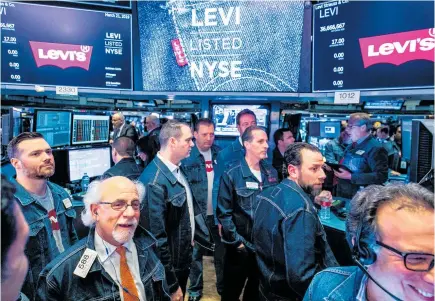  ?? Photo / Bloomberg ?? New York Stock Exchange traders donned denim for the listing of Levi Strauss last month.