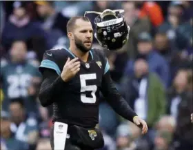  ?? TIM IRELAND — ASSOCIATED PRESS ?? Jaguars quarterbac­k Blake Bortles tosses his helmet after failing in a two-point conversion attempt against the Eagles in London.