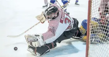  ?? BOB TYMCZYSZYN/POSTMEDIA NEWS ?? St. Catharines Falcons goalie Owen Savory reaches for the loose puck on a shot by the Caledonia Corvairs in Jr. B Golden Horseshoe hockey at the Gatecliff arena in St. Catharines in this file photo.