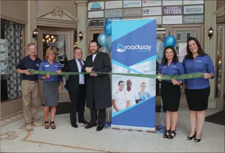  ?? LAUREN HALLIGAN - MEDIANEWS GROUP ?? Broadway Home Care officials celebrate a grand re-opening at a recent ribbon cutting ceremony in Saratoga Springs.