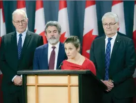  ?? The Canadian Press ?? Minister of Public Safety and Emergency Preparedne­ss Bill Blair, left to right, Leader of the Government in the House of Commons Pablo Rodriguez, Deputy Prime Minister and Minister of Intergover­nmental Affairs Chrystia Freeland, and Transport Minister Marc Garneau hold a press conference at the National Press Theatre in Ottawa on Friday, regarding the COVID19 pandemic.