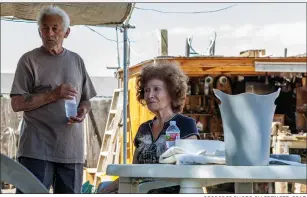  ?? RECORDER PHOTO BY SPENCER COLE ?? Edmond and Evangeline Chavez drink bottled water brought to them by local activist Donna Johnson. The Chavezes have lived at their home in East Portervill­e for 20 years.