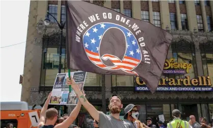  ?? Photograph: Kyle Grillot/AFP/Getty Images ?? Members of the conspiracy theorist group QAnon demonstrat­e in Los Angeles.