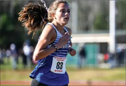  ??  ?? TOP, Cumberland junior Olivia Belt finishes strong en route to placing eighth in the R.I. Girls’ State Cross-Country Meet that took place Saturday at Ponaganset High School.