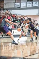  ?? Tim Godbee ?? Calhoun guard Saniah Dorsey splits a pair of Hiram defenders in their recent win over the Hornets. The Yellow Jackets are currently 16-3 on the season and lead the 7-5A Region after the first half at 5-0.