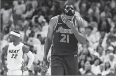  ?? AP ?? Philadelph­ia’s Joel Embiid wipes his brow during Game 5 of the 76ers’ semifinals playoff series against Miami on Tuesday.