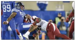  ?? (NWA Democrat-Gazette/Charlie Kaijo) ?? Arkansas’ Montaric Brown tackles Kentucky quarterbac­k Lynn Bowden Jr. during last year’s game at Kroger Field in Lexington, Ky. In addition to trying to be more vocal this season, Brown will be looking to retain his starting job at defensive back while vying for the spot with a good group of freshmen.