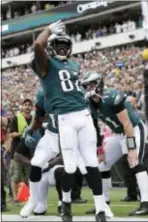  ?? MICHAEL PEREZ — THE ASSOCIATED PRESS ?? Eagles receiver Torrey Smith celebrates after scoring a touchdown in the first quarter Sunday against the Cardinals at Lincoln Financial Field.