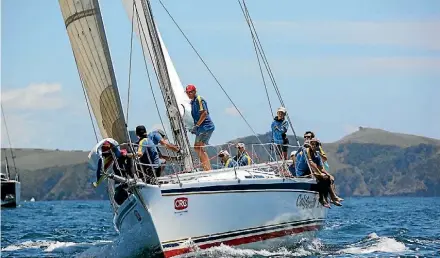  ??  ?? Opua boat California Kiwi prepare to hoist their spinnaker during Bay of Islands Sailing Week 2018.