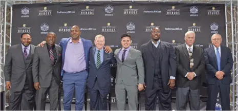  ?? KIRBY LEE, USA TODAY SPORTS ?? Members of the Pro Football Hall of Fame’s Class of 2015 are introduced Jan. 31 in Phoenix. From left: Jerome Bettis, Tim Brown, Charles Haley, Bill Polian, Tyler Seau (representi­ng his late father, Junior), Will Shields, Mick Tingelhoff and Ron Wolf.