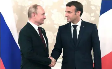  ?? AFP ?? RUSSIAN President Vladimir Putin and French President Emmanuel Macron.