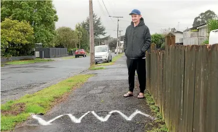  ??  ?? Jamie Hansen is frustrated that his contact with the council about the state of his footpath is going unanswered.