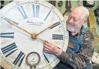  ?? JENNIFER GAUTHIER ?? Raymond Saunders, a Vancouver clockmaker, sets the time in March. Changing clocks back and forth into daylight saving time is now widely condemned by health and safety experts.