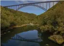  ??  ?? The New River Gorge Bridge, seen from Fayette Station, was once the world’s longest single-span arch bridge. Photograph: F Brian Ferguson/AP