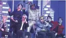  ?? MATT SAYLES/INVISION/AP ?? Lil Nas X sings “Old Town Road” with members of the South Korean pop group BTS at the Grammy Awards last year.