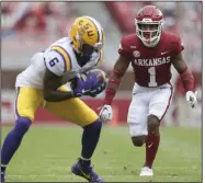  ?? (NWA Democrat-Gazette/Charlie Kaijo) ?? Arkansas safety Jalen Catalon (1) covers LSU wide receiver Terrace Marshall during Saturday’s game. Catalon is set to miss the first half of next week’s game at Missouri after he was ejected for targeting in the fourth quarter. More photos at arkansason­line. com/1122hogs/