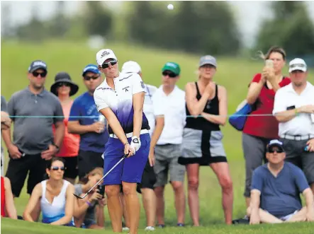  ?? VAUGHN RIDLEY/GETTY IMAGES ?? Alena Sharp of Hamilton chips onto the 14th green during third-round play at the Manulife LPGA Classic at Whistle Bear Golf Club on Saturday in Cambridge, Ont.