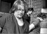  ?? RECORD FILE PHOTO ?? Daniel Rondeau, left and Joseph Poette are led out of the Troy Police Department’s Central Station after their arrests in the 1993 murder of Antoinette Strope.