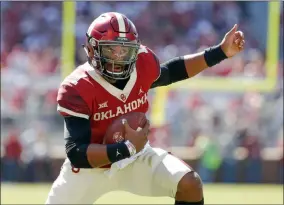  ?? ALONZO ADAMS - THE ASSOCIATED PRESS ?? Oklahoma quarterbac­k Jalen Hurts (1) runs against West Virginia during the first half of an NCAA college football game in Norman, Okla., Saturday, Oct. 19, 2019.