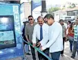  ??  ?? The opening of the first Mobitel “Smart Bus Halt” by the Minister of Telecommun­ications and Digital Infrastruc­ture Harin Fernando, Sri Lanka Telecom and Mobitel Chairman P. G. Kumarasing­hesirisena. Also present was Mobitel Chief Operating Officer Nalin...