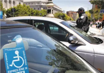  ?? Michael Macor / The Chronicle ?? As many as 1 in 8 disabled parking placards are used fraudulent­ly in San Francisco, limiting parking for people with actual disabiliti­es. Critics are looking for ways to crack down.