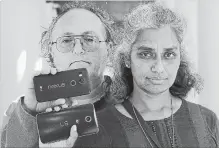  ?? JEFF CHIU THE ASSOCIATED PRESS ?? Kalyanaram­an Shankari, right, pictured with her husband Thomas Raffill, noticed that her Android phone prompted her to rate a shopping trip even though she had turned off Google’s location history setting.