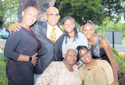  ?? CONTRIBUTE­D PHOTOS ?? From left (back row) Rochelle Stephenson, Bishop Rupert Stephenson, Tiandre Stephenson, Kimberly Fearon, and Pastor Pauline Stephenson (left, front row) and Tannecia Stephenson celebrate the happy occasion.