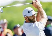  ?? WARREN LITTLE / GETTY IMAGES ?? World No. 1 Dustin Johnson plays from the seventh tee during a practice round at Shinnecock Hills Golf Club on Tuesday.