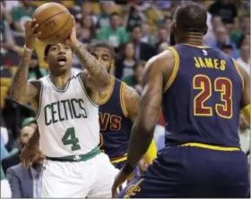  ?? THE ASSOCIATED PRESS FILE PHOTO ?? Celtics guard Isaiah Thomas (4) prepares to shoot as Cavaliers forward LeBron James defends.