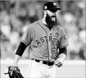  ?? ELSA/GETTY ?? Dallas Keuchel is charged up in the third inning of his dominant start Friday night against the Yankees.