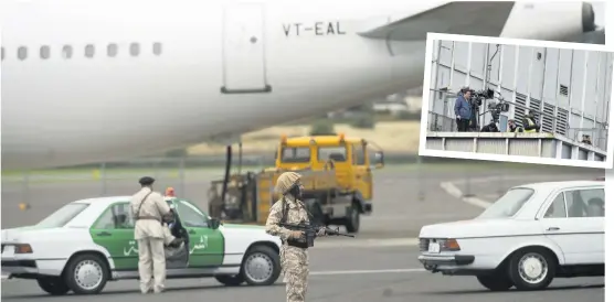  ??  ?? Bollywood scene
Actors dressed as police and military hold guns on the runway. Inset: Film crews at the airport