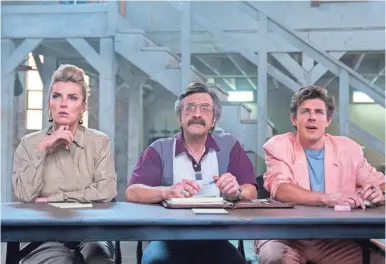  ??  ?? Debbie (Betty Gilpin) faces a different type of sexism when she becomes a producer of the wrestling show in Season 2 of “GLOW,” where she works alongside Bash (Chris Lowell) and Sam (Marc Maron).