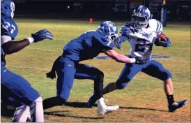  ?? Photos by FRANK CROWE / For the Calhoun Times ?? ( Gordon Central running back Branson Towe (24) is swarmed by Armuchee defenders during last Friday’s game. ( Gordon Central’s Jordon Green (8) looks to haul in a pass.