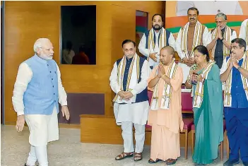  ?? —PTI ?? Prime Minister Narendra Modi, BJP president Amit Shah, senior ministers Rajnath Singh, Nitin Gadkari and Arun Jaitley in a group photograph with the party chief ministers during a meeting in New Delhi on Tuesday.