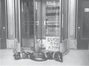  ?? COURTESYPH­OTOS ?? Unknown protesters placed fake body bags and a sign stating“Eviction is not a joke”at the entrance of Hartford City Hall on Thursday to call attention to the ongoing housing and eviction crisis.