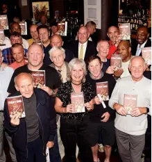  ?? Photo: PHILIP SHARKEY ?? PROUD MOMENT: Lloyd is flanked by some familiar faces as she celebrates the release of her book at the recent LEBA meeting