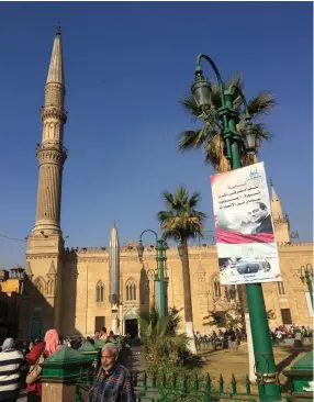  ??  ?? A POSTER of Egyptian president Abdel Fatah al-Sisi hangs outside Al-Azhar University in Cairo, the Sunni Muslim world's most presigious center of Islamic learning.
