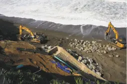  ??  ?? Owners of property that was eroding on Esplanade Avenue in Pacifica placed boulders on the beach below in violation of the state Coastal Act.