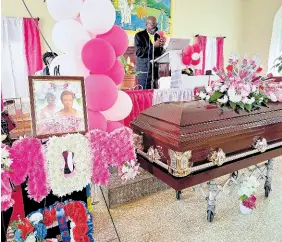  ?? PHOTO BY RASBERT TURNER ?? The body of Enid Francis lies inside the Wheeler’s Mount Baptist Church, where mourners gathered for her funeral on February 19.