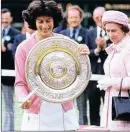  ??  ?? ROYALTY: Virginia Wade receiving her trophy from Queen Elizabeth.