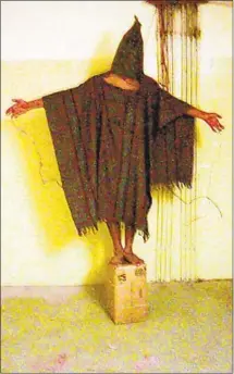  ?? Associated Press ?? AT ABU GHRAIB prison in Baghdad in 2003, detainee Ali Shallal al-Qaisi was tortured during a CIA interrogat­ion.