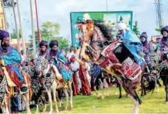  ??  ?? A young horse rider struggling with his horse during Sallah celebratio­n in Kano.