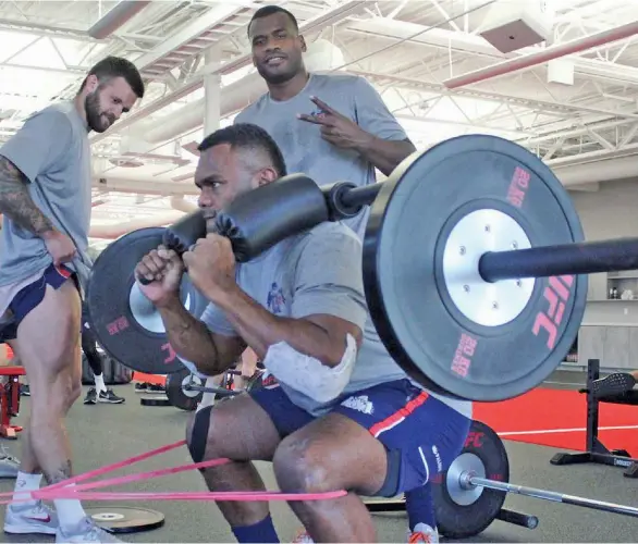  ?? Photo: ?? Former Flying Fijians flanker Naulia Dawai (on weights) and Poasa Waqanibau training at their New England Free Jacks club..
MLR