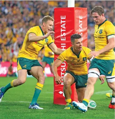  ??  ?? Australian Wallabies second five eight Matt Toomua (middle) celebrates his try against South Africa at the Suncorp Stadium, Brisbane in Australia on September 8, 2018. Photo: Zimbio