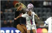  ?? PHOTO BY RAUL ROMERO JR. ?? OL Reign forward Megan Rapinoe, right, heads the ball in a battle against Angel City FC defender Sarah Gorden.