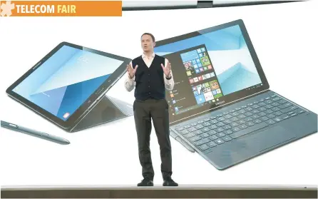  ?? — AFP ?? Chief Marketing Officer of Samsung Electronic­s Europe, David Lowes, presents the tablet Samsung Galaxy Book during a press conference in Barcelona.