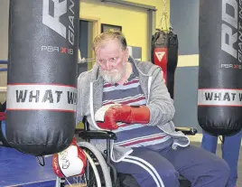  ??  ?? Douglas Mcdougall of Truro is seen practising some boxing moves as a way to reduce the debilitati­ng effects of Parkinson's disease.