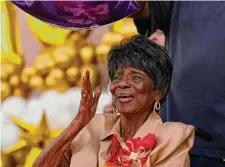  ?? Marie D. De Jesús/Staff photograph­er ?? Miola Donahue Laws, 103, blows a kiss to friends and family wishing her a happy birthday on Saturday during a car parade for her at Pilgrim Rest Missionary Baptist Church in Houston.