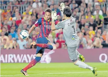  ?? AP ?? Barcelona’s Neymar, left, duels for the ball against Real Sociedad goalkeeper Claudio Bravo.