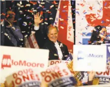  ?? Justin Sullivan / Getty Images ?? Senator-elect Doug Jones greets backers at his victory party in Birmingham, Ala., after defeating Republican Roy Moore.